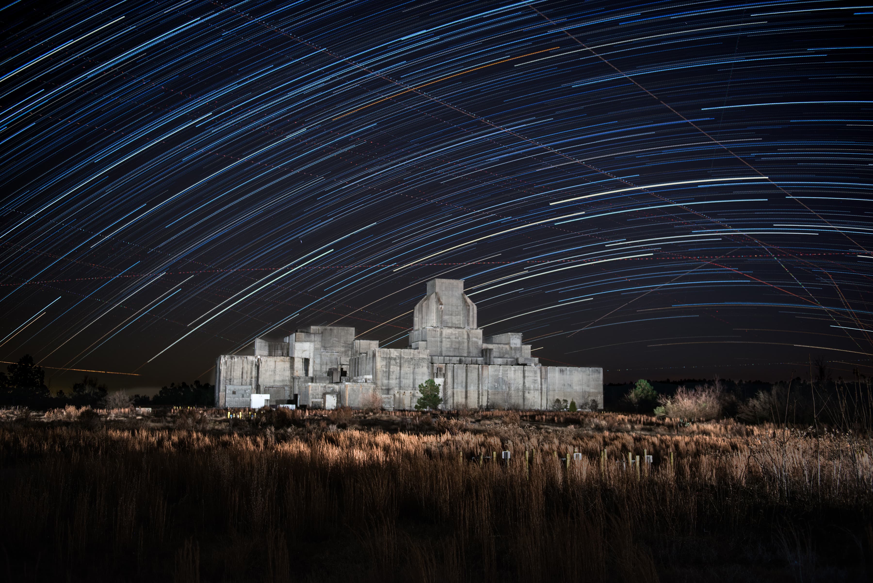 Time lapse photo with stars passing over facility